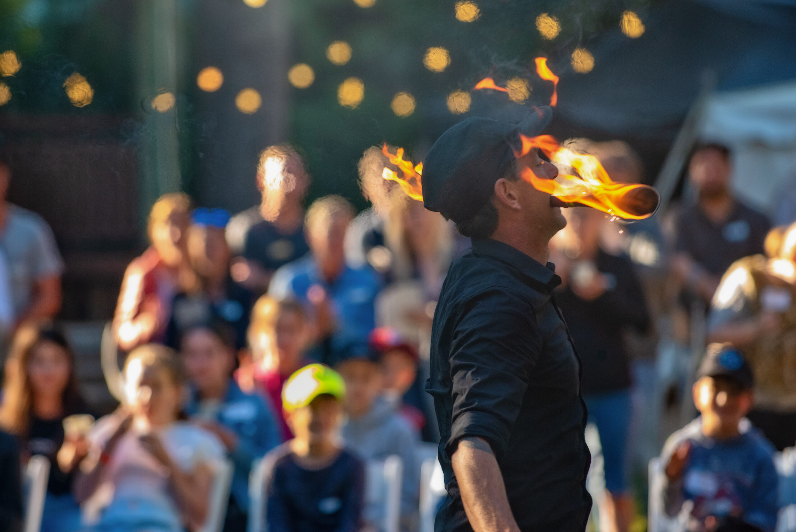 A fire performer entertaining families at a YPO experience