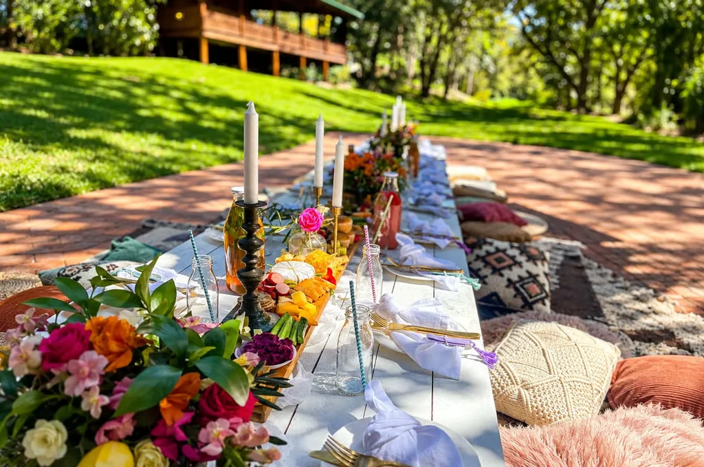 Boho picnic table in the gardens at Swamis Yoga Retreat